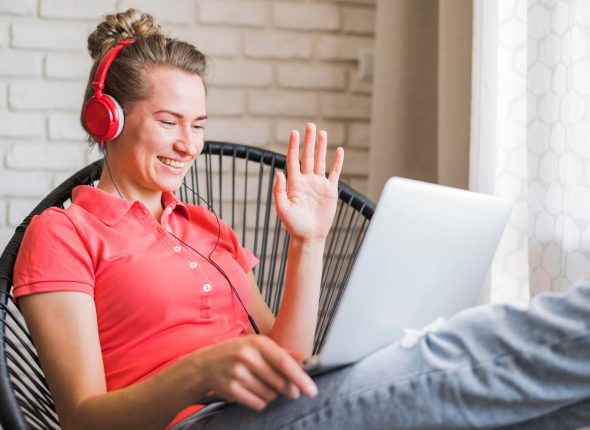 front-view-smiling-woman-with-laptop_23-2148521587